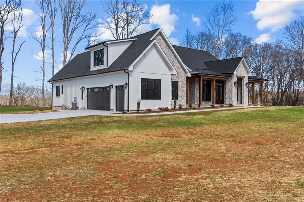 Photo of 765 Golf Course Road, Pilot Mountain, NC 27041 (MLS # 1211956)