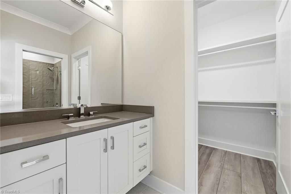 Welcome to this modern custom luxury home by Walraven Signature Homes, – image 24