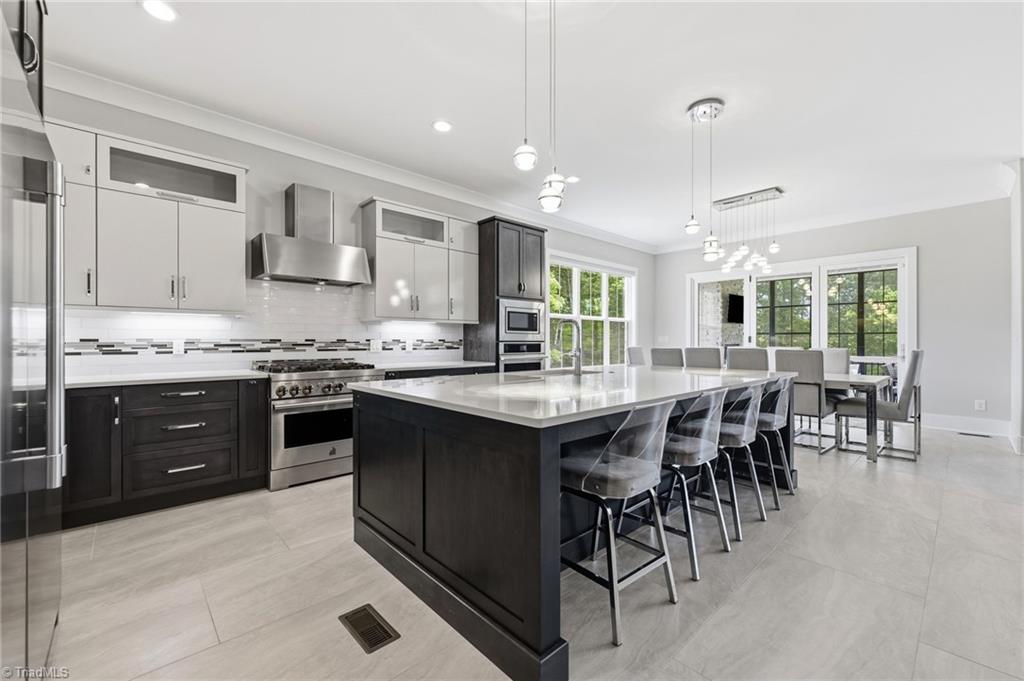 Welcome to this modern custom luxury home by Walraven Signature Homes, – image 14