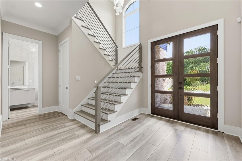 Welcome to this modern custom luxury home by Walraven Signature Homes, – image 2