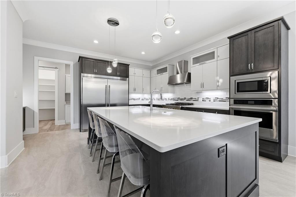 Welcome to this modern custom luxury home by Walraven Signature Homes, – image 13