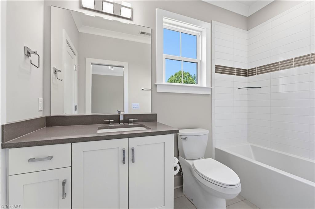 Welcome to this modern custom luxury home by Walraven Signature Homes, – image 20