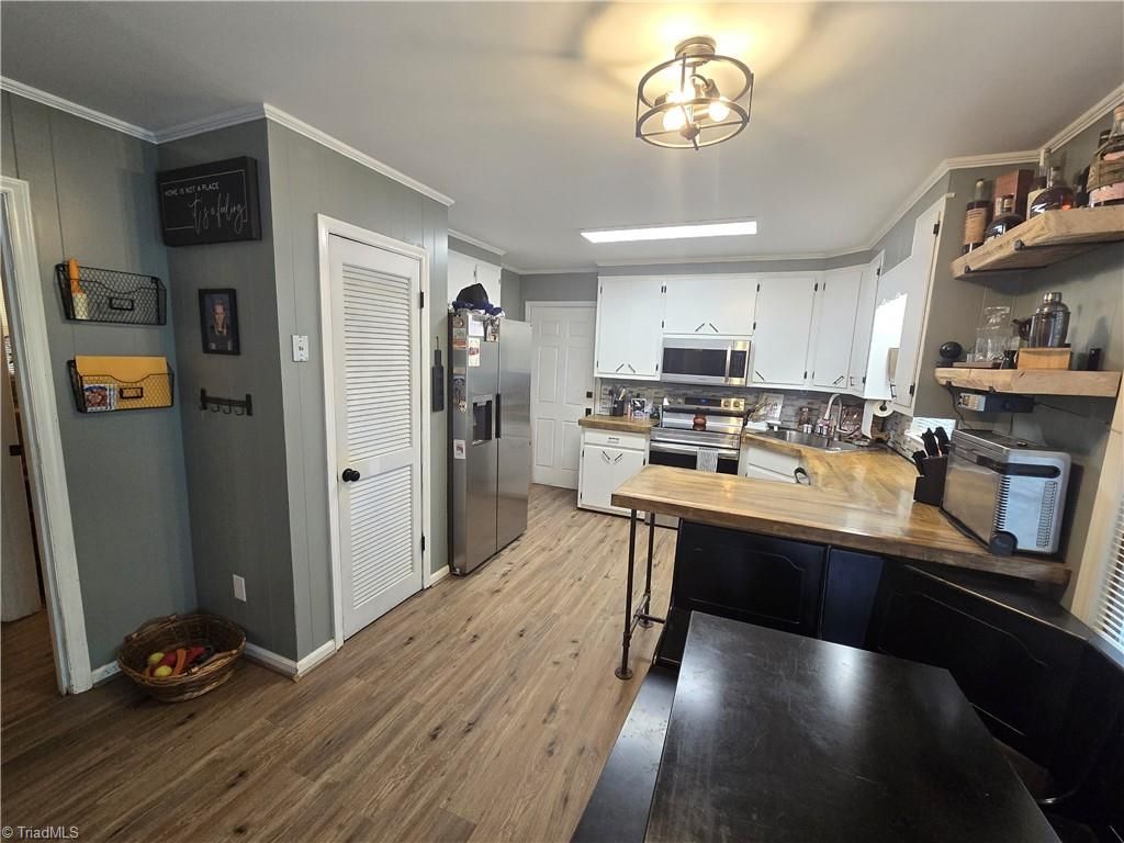 Photo of 706 TownBranch Road, Graham, NC 27253 (MLS # 1218477)