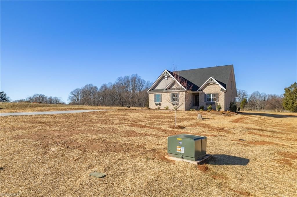 Photo of 8305 Pyramid Drive, Summerfield, NC 27358 (MLS # 1198174)