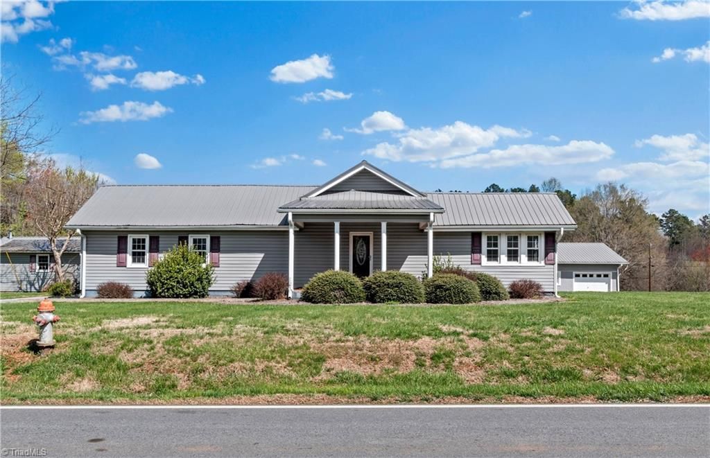 Photo of 613 Nc Highway 67, Boonville, NC 27011 (MLS # 1212709)