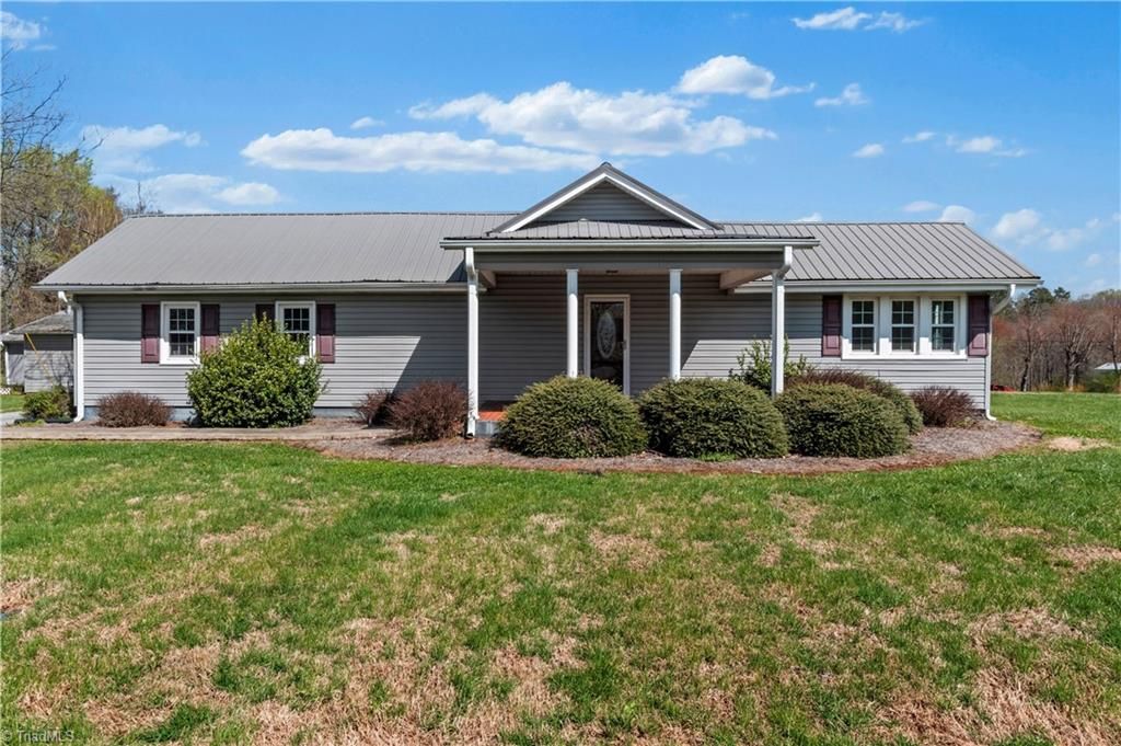 Photo of 613 Nc Highway 67, Boonville, NC 27011 (MLS # 1212709)