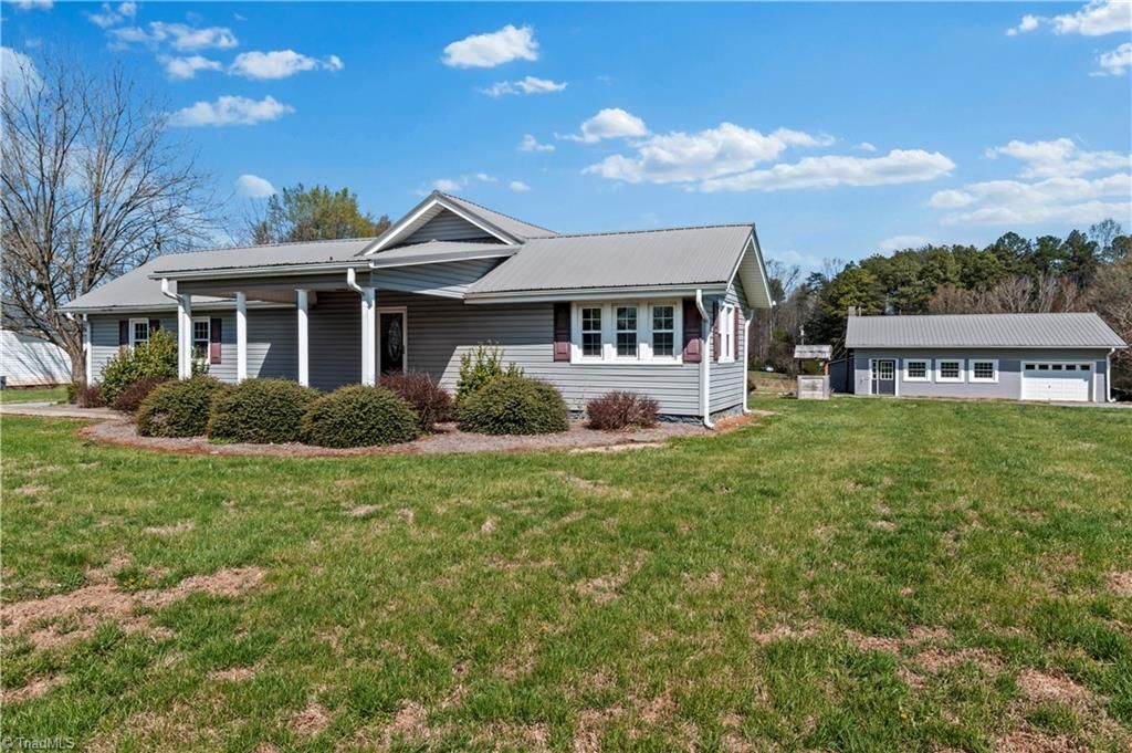 Photo of 613 Nc Highway 67, Boonville, NC 27011 (MLS # 1212709)