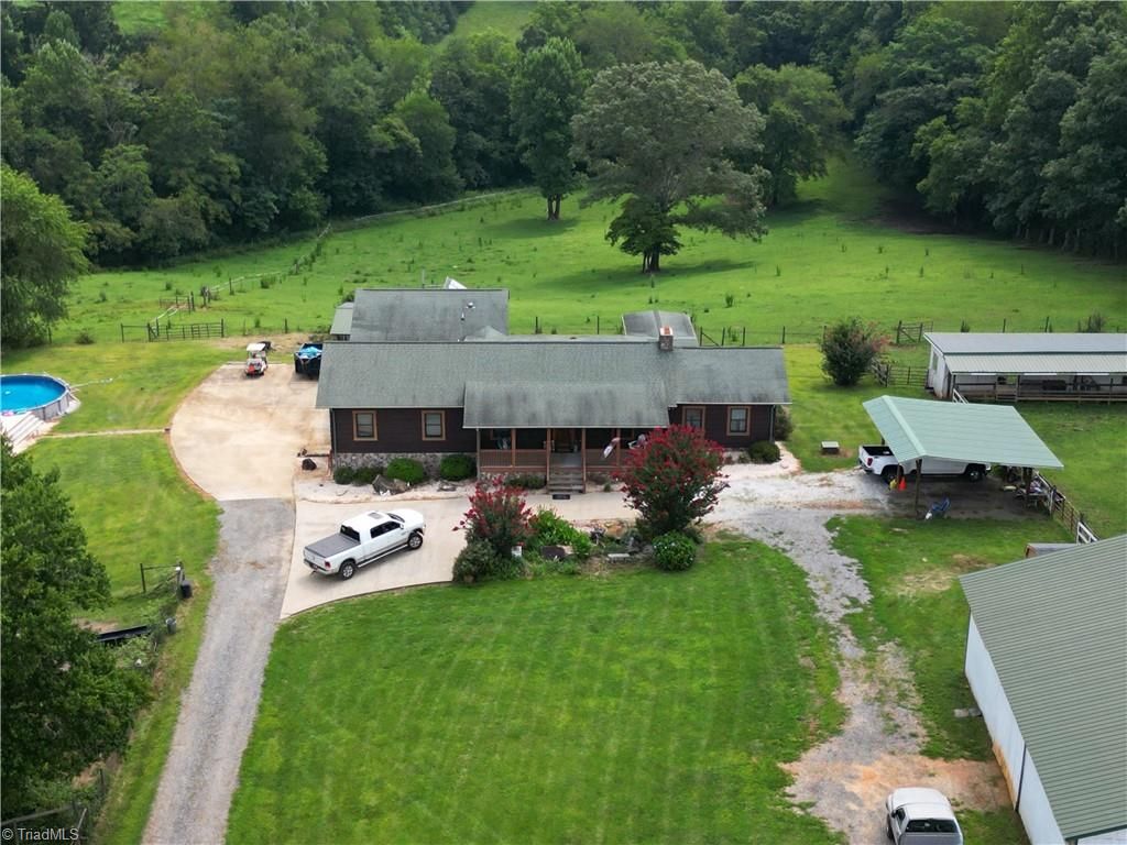 Photo of 300 Tom Hunter Road, Pilot Mountain, NC 27041 (MLS # 1200325)