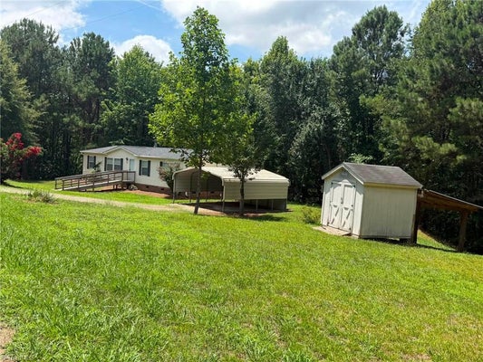 1042 WELLS CREEK RD, MADISON, NC 27025 - Image 85d16b65cd57cb8b3aa3f856d65cd703/4011215576