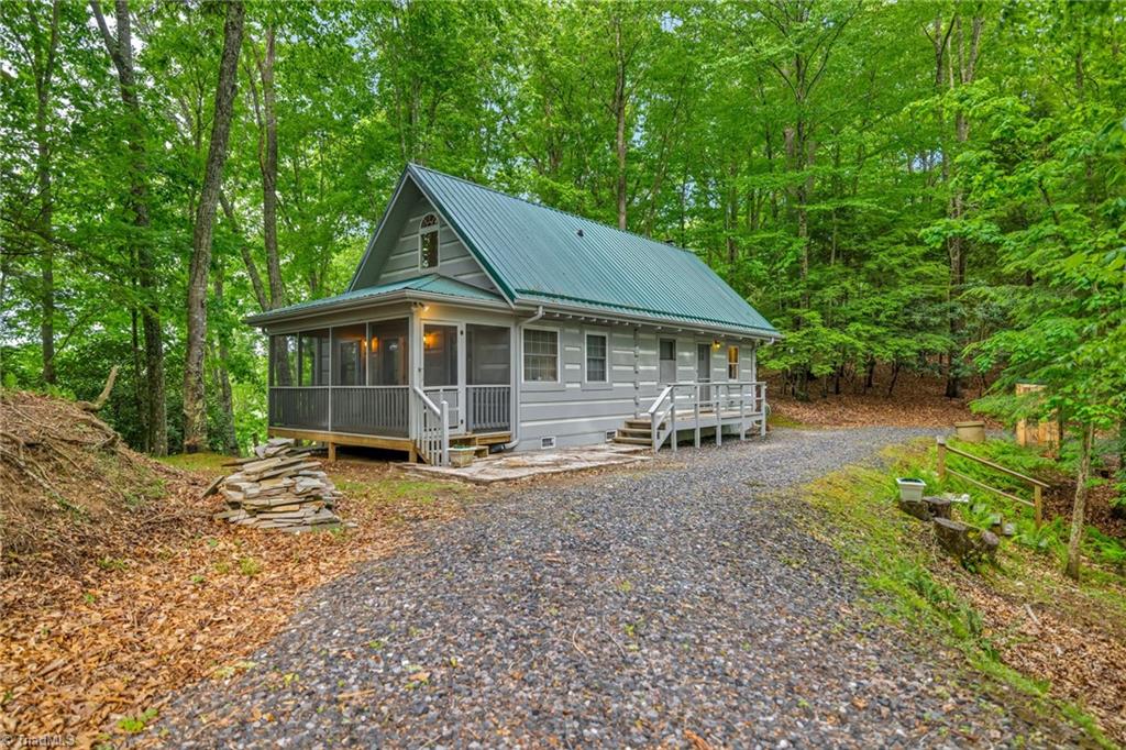 Photo of 638 Riverwood Trail, Lansing, NC 28543 (MLS # 1223984)