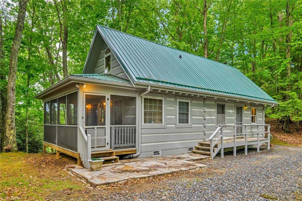 Photo of 638 Riverwood Trail, Lansing, NC 28543 (MLS # 1223984)