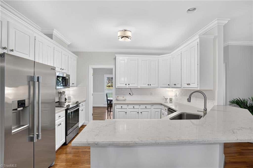 Photo of 704 Glendevon Court N, Whitsett, NC 27377 (MLS # 1230502)