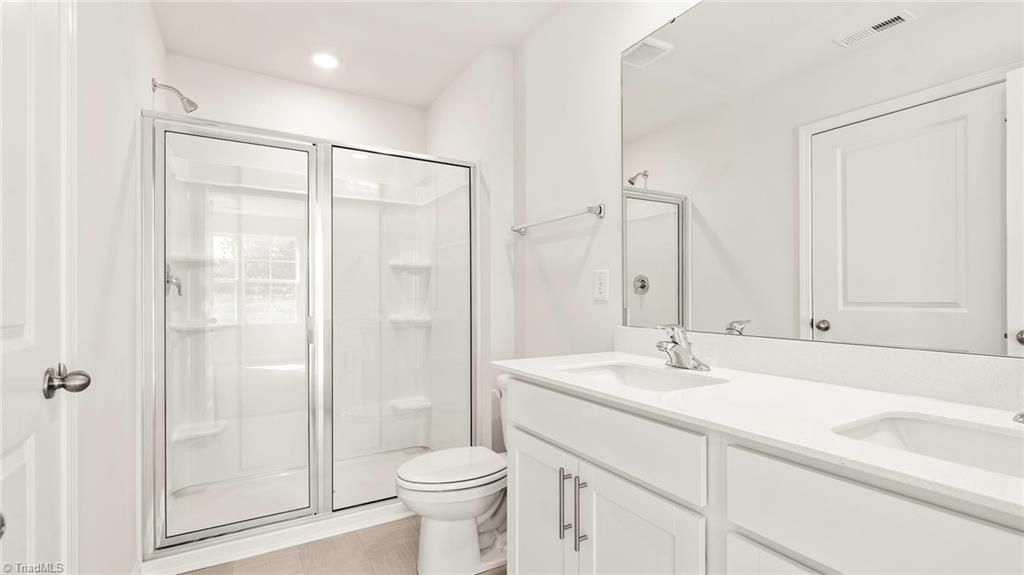 Photo of 7135 Royal Ascot Drive, Whitsett, NC 27377 (MLS # 1208447)