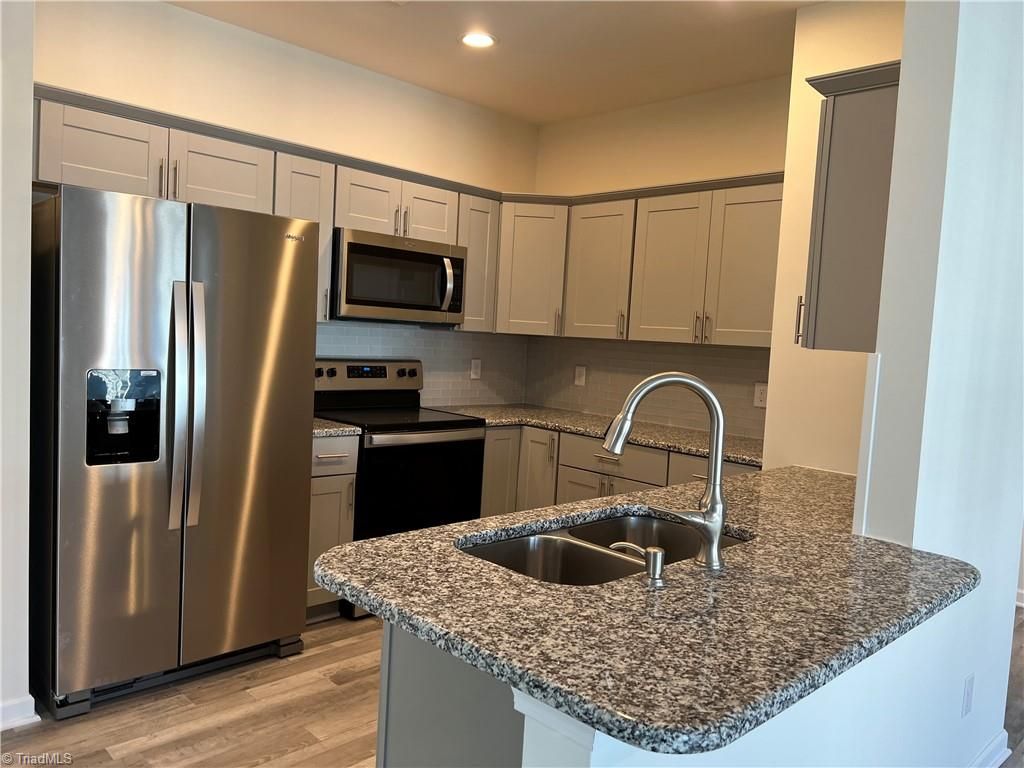 Photo of 2607 Pennoak Way #J, Greensboro, NC 27407 (MLS # 1210891)