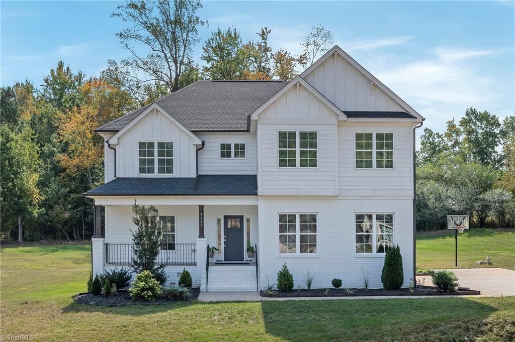 Photo of 7111 Lambert Lake Road, Stokesdale, NC 27357 (MLS # 1218586)