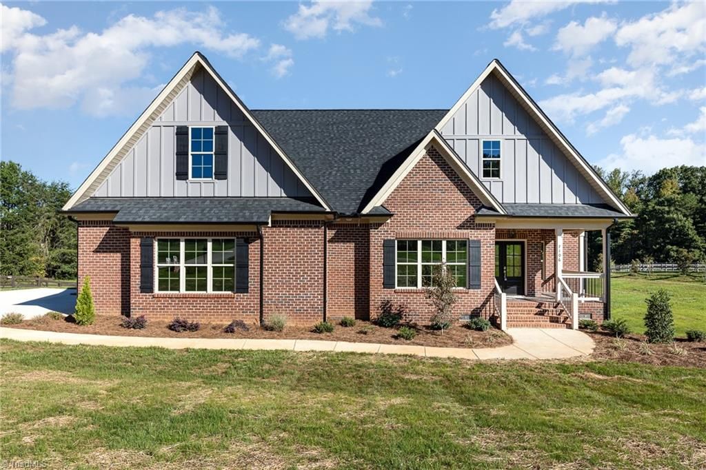 Photo of 7106 Lambert Lake Road, Stokesdale, NC 27357 (MLS # 1218556)