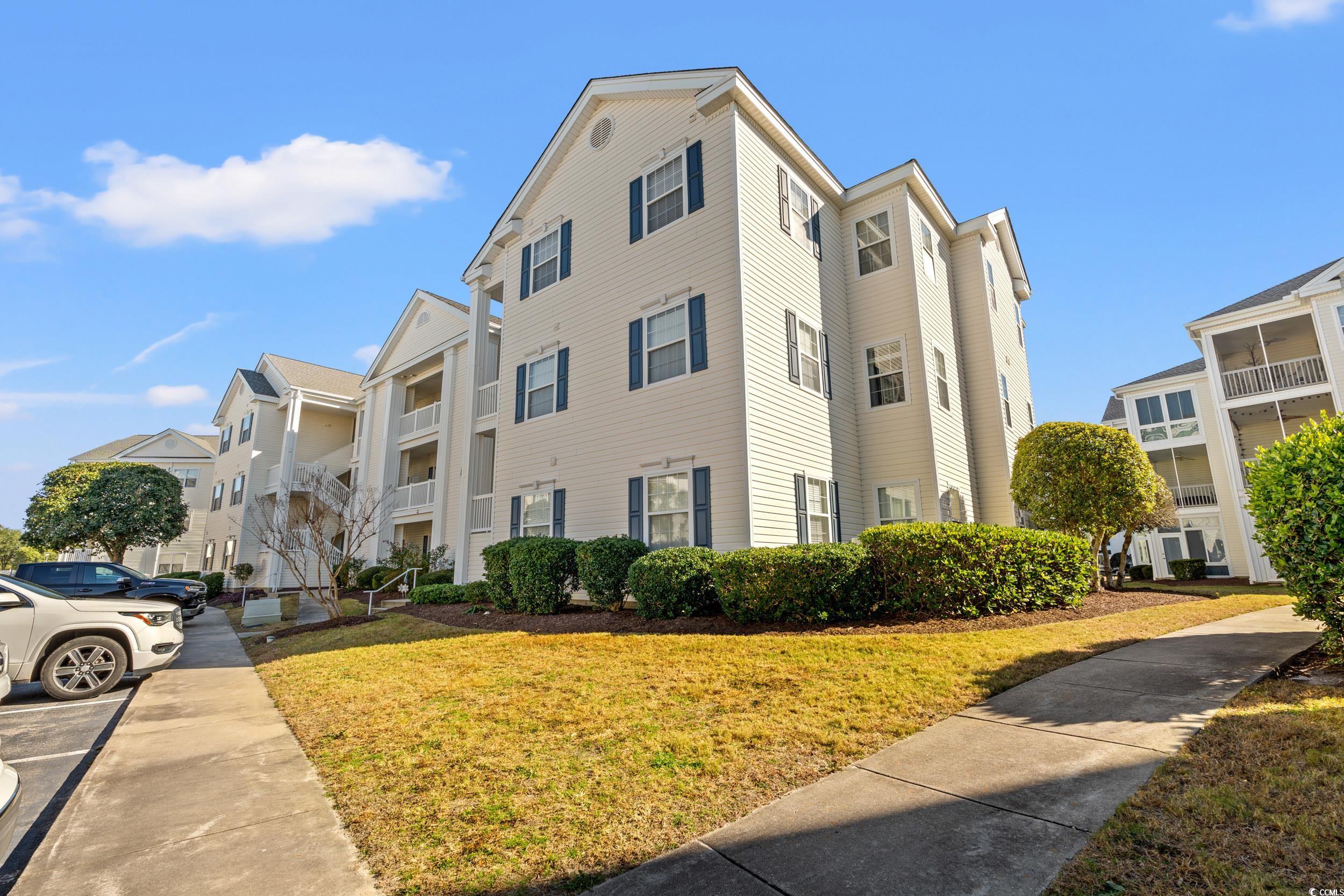 View of apartment building / complex with uncovere