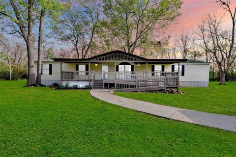 Photo of 613 River Road, Goodrich, TX 77335 (MLS # 26861996)