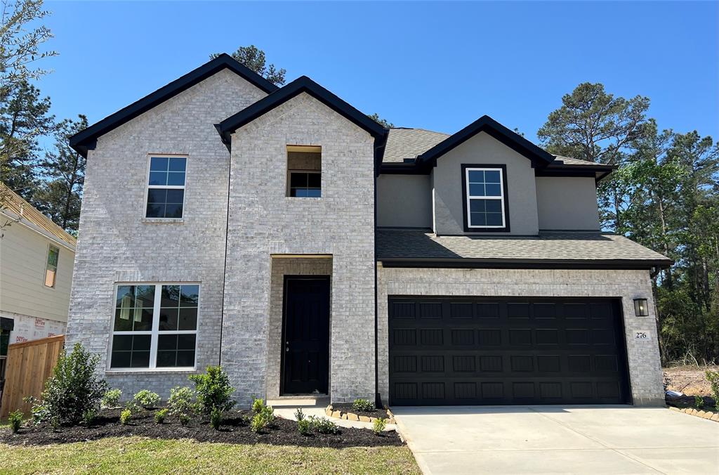 276 Warbler Song Drive, Willis, Texas image 1