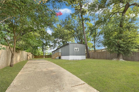 Photo of 11719 S Spicewood Lane, Houston, TX 77044 (MLS # 62116911)