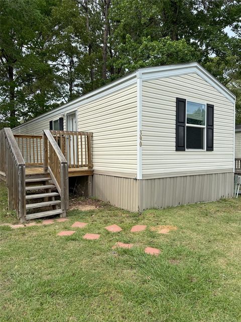 Photo of 390 Hidden Oaks Drive, Point Blank, TX 77364 (MLS # 42070316)