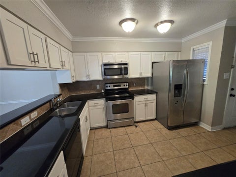 Photo of 5661 Birchmont Drive #5, Houston, TX 77091 (MLS # 71789835)