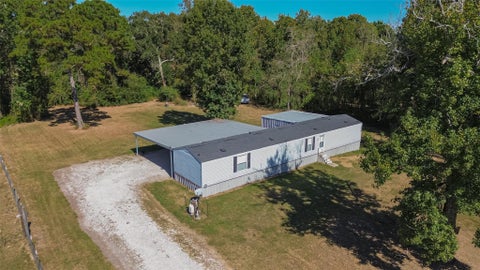 Photo of 560 County Road 142, Liberty, TX 77575 (MLS # 76228438)