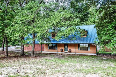 Photo of 3660 Red Bud Lane, Huntsville, TX 77340 (MLS # 33791668)