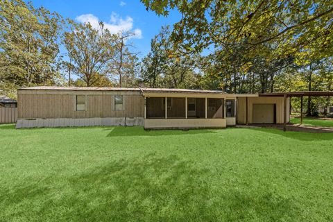 Photo of 127 County Road 3371, Cleveland, TX 77327 (MLS # 96766999)