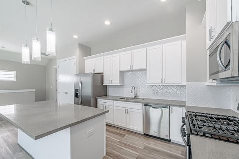 Photo of 240 Julia Street #E, Houston, TX 77022 (MLS # 93224678)