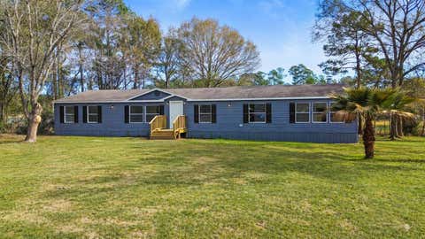 Photo of 11759 W Hollyhill Drive, Plantersville, TX 77363 (MLS # 20508334)
