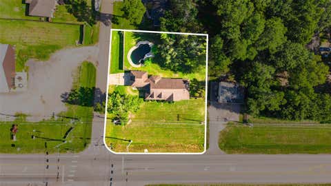 Photo of 8874 Spring Woods Drive, Montgomery, TX 77316 (MLS # 40913776)