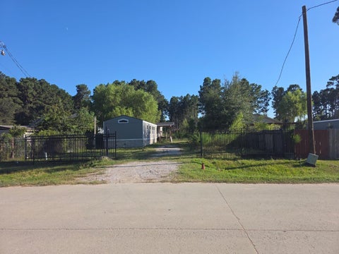 Photo of 446 County Road 3546, Cleveland, TX 77327 (MLS # 88373198)