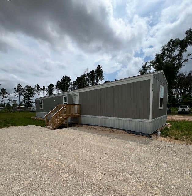 Photo of 614 Cr 5253, Cleveland, TX 77327 (MLS # 95719813)
