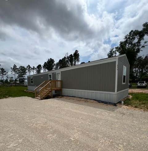 Photo of 614 Cr 5253, Cleveland, TX 77327 (MLS # 95719813)
