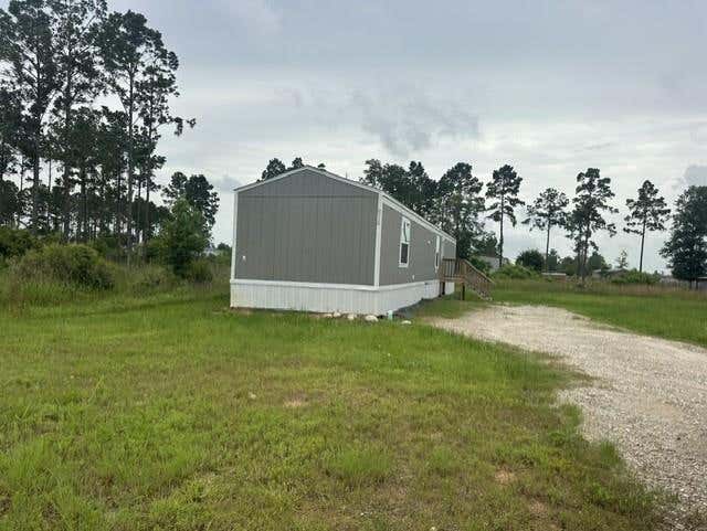 Photo of 614 Cr 5253, Cleveland, TX 77327 (MLS # 95719813)