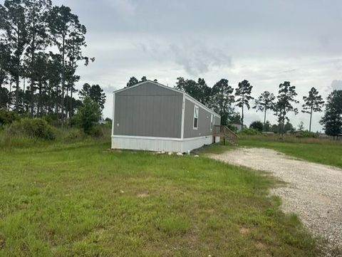 Photo of 614 Cr 5253, Cleveland, TX 77327 (MLS # 95719813)