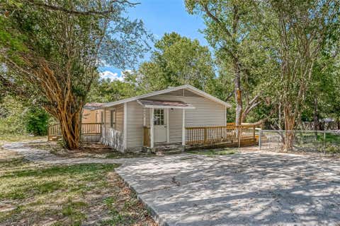 Photo of 10694 Pine Street, Willis, TX 77318 (MLS # 23084752)