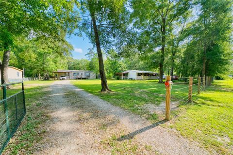 Photo of 103 County Road 370, Splendora, TX 77372 (MLS # 48057589)