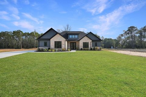 Photo of 15045 Tybee Ln Ln, Conroe, TX 77306 (MLS # 74701984)