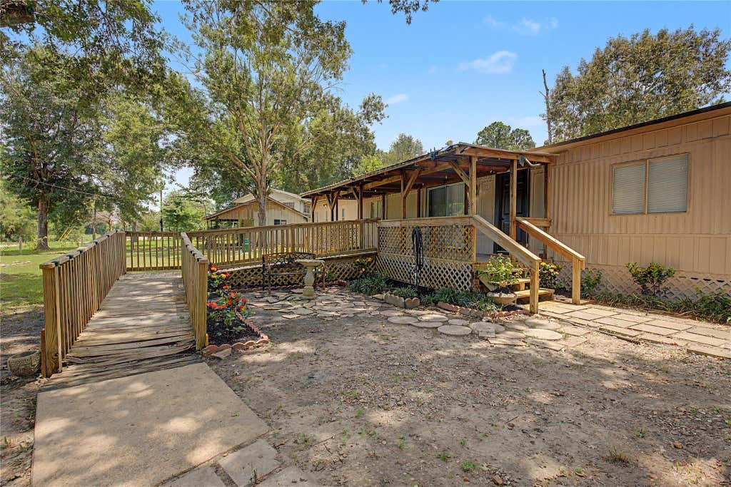 Photo of 65 Brazil Boulevard, Huntsville, TX 77320 (MLS # 2285640)