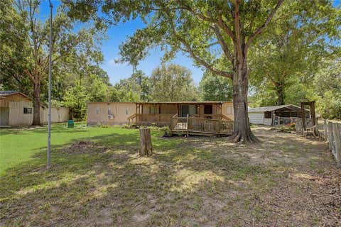 Photo of 65 Brazil Boulevard, Huntsville, TX 77320 (MLS # 2285640)