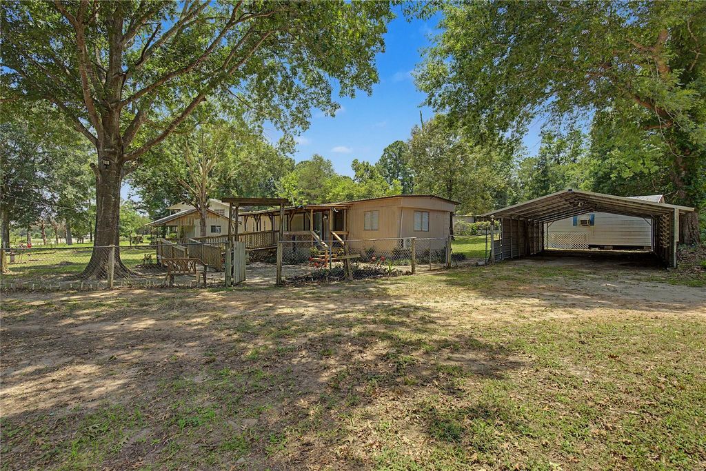 Photo of 65 Brazil Boulevard, Huntsville, TX 77320 (MLS # 2285640)