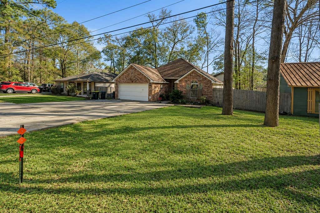 Photo of 411 Shawnee Drive, Conroe, TX 77316 (MLS # 49773571)