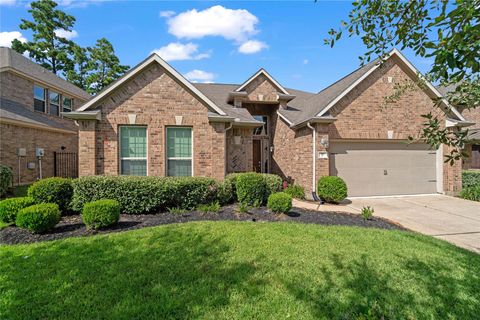 Photo of 26 Whispering Thicket Place, Tomball, TX 77375 (MLS # 92546048)
