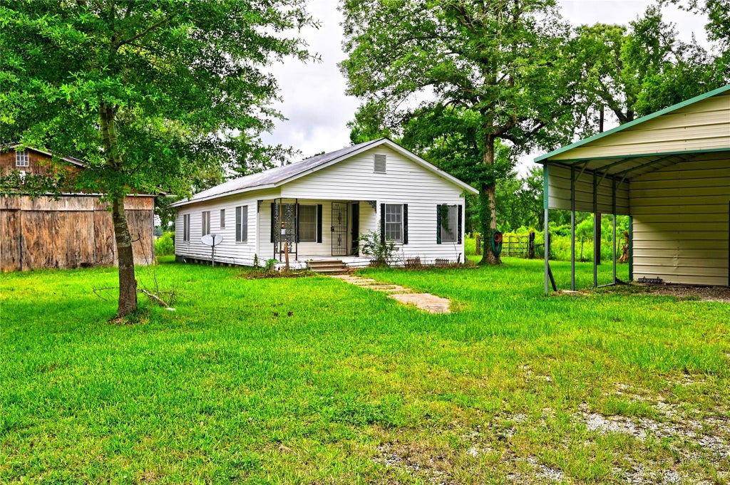 Photo of 1083 County Road 3141 E, Cleveland, TX 77327 (MLS # 73216426)