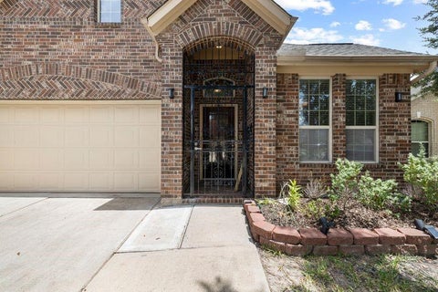 Photo of 12610 Redbud Villa Lane, Houston, TX 77086 (MLS # 81955794)