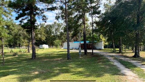 Photo of 406 County Road 3415, Cleveland, TX 77327 (MLS # 38801677)