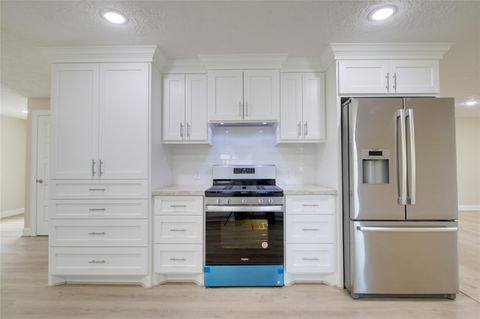 Photo of 211 S Cleveland Avenue, Cleveland, TX 77327 (MLS # 61941738)