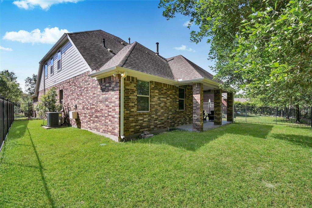 Photo of 22 Wood Drake Place, Tomball, TX 77375 (MLS # 52325079)